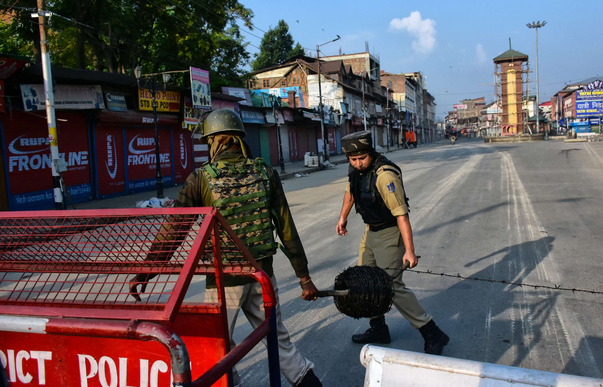 Indian paramilitary troopers closes the road leading to Clock tower with barbed wire during curfew in Srinagar , Indian Administered Kashmir on 05 August 2019. Strict curfew was implemented in Kashmir on 05 August 2019 following the decision to scrap Article 370 which gave a special status to Kashmiri people. A complete communication blackout and curfew is implemented in Kashmir Valley from Midnight 05 August 2019.
